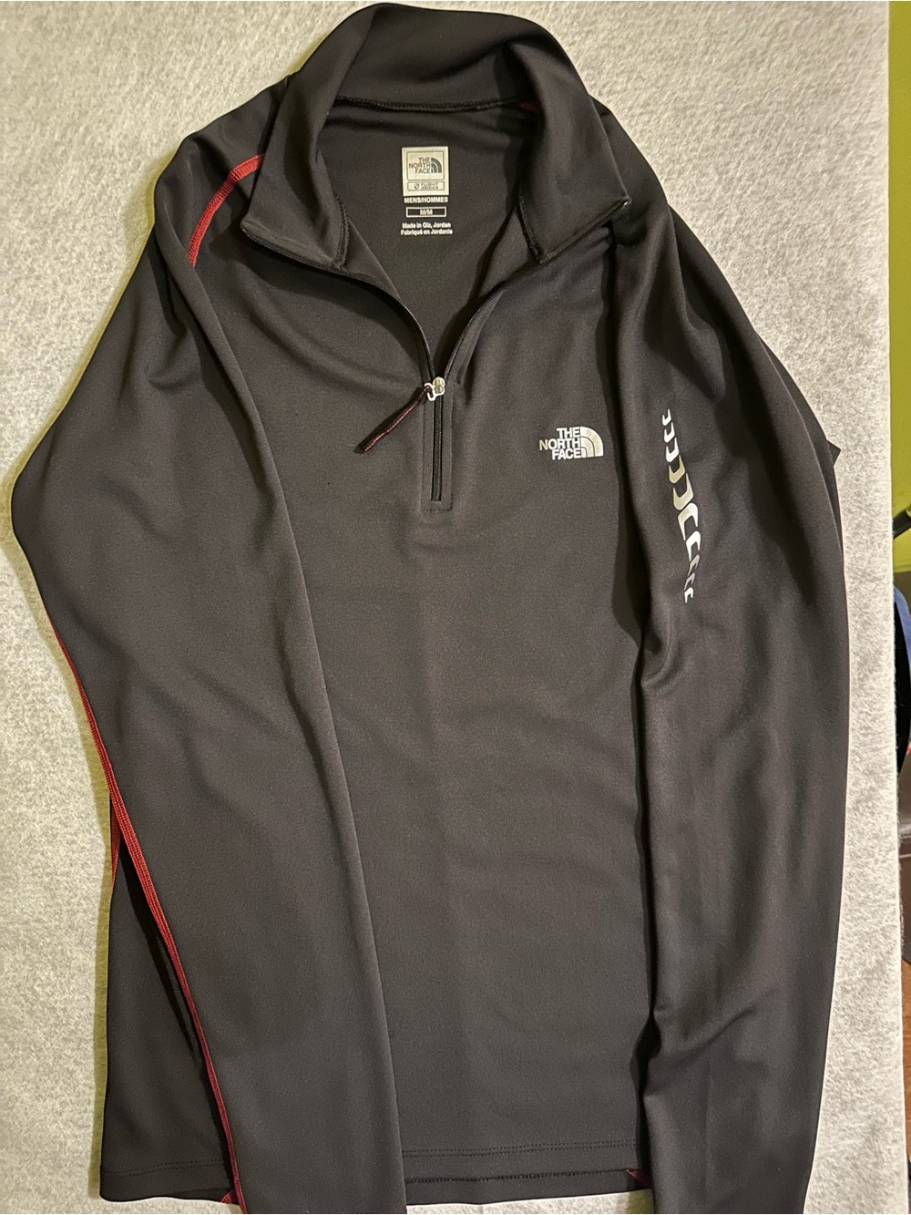 The North Face Men’s Black Half-Zip Performance Jacket with Red Accents